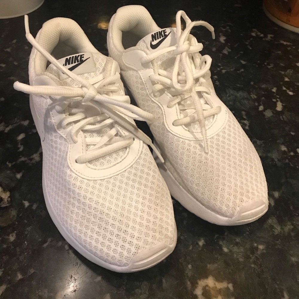 Women’s white Nike running shoes